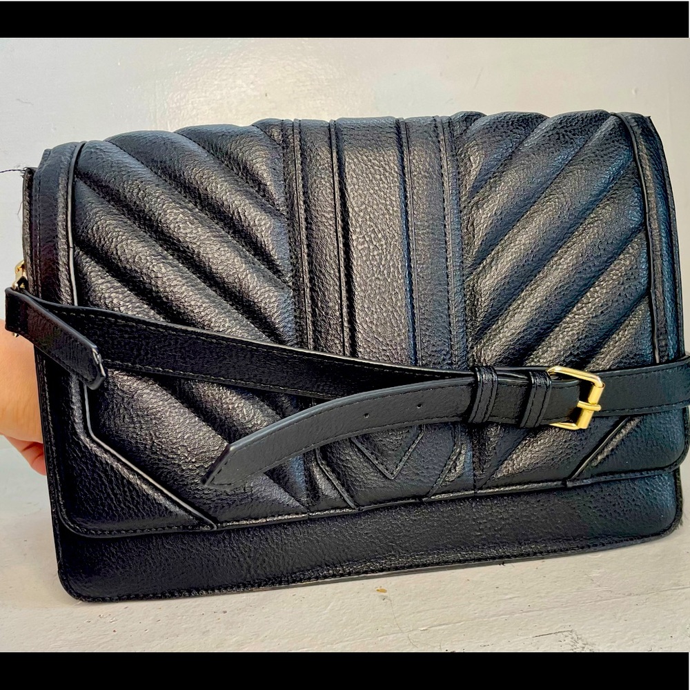 Steve Madden handbag with shoulder and cross body strap.